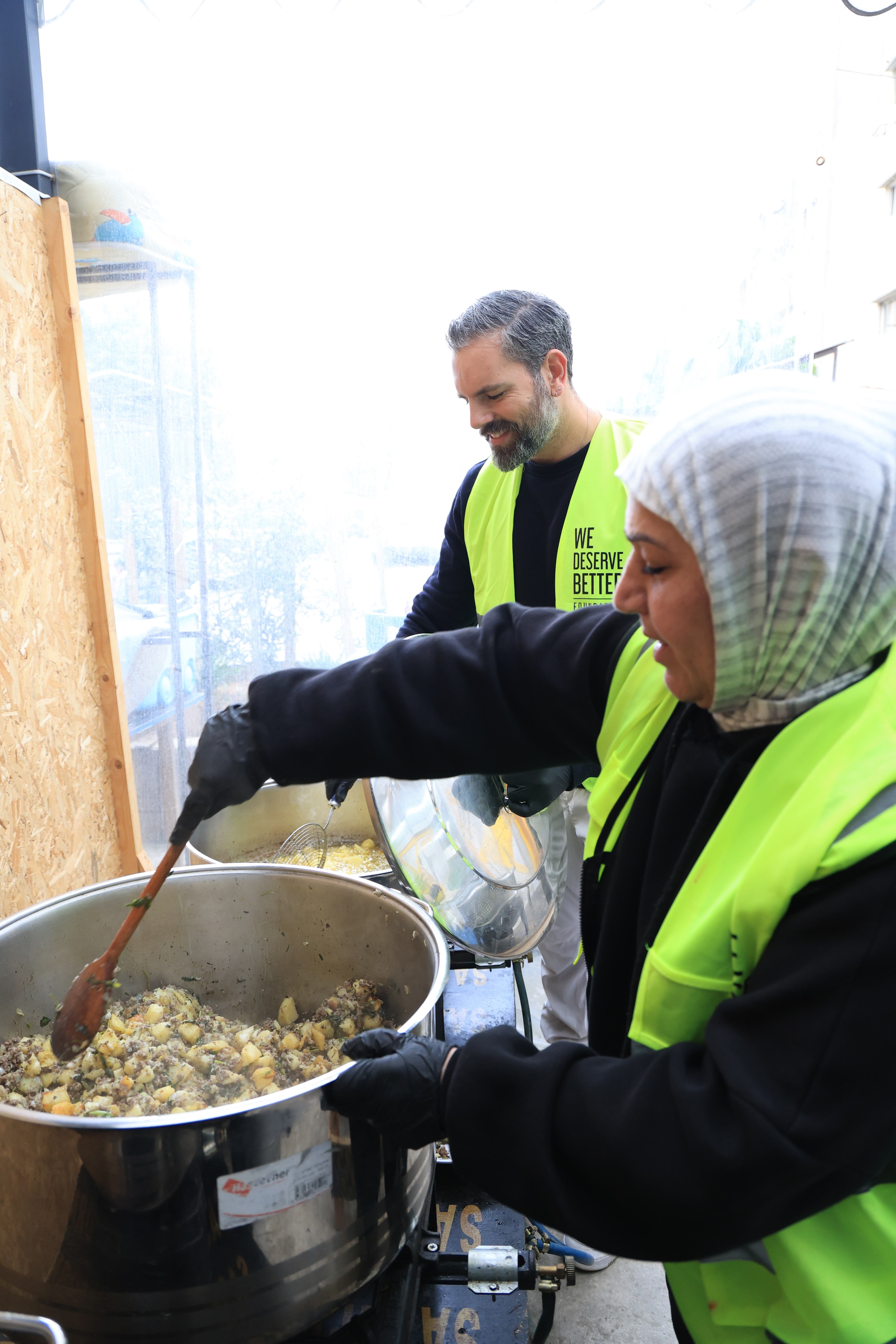 WDBF volunteers cooking hot meals for displaced families in Lebanon