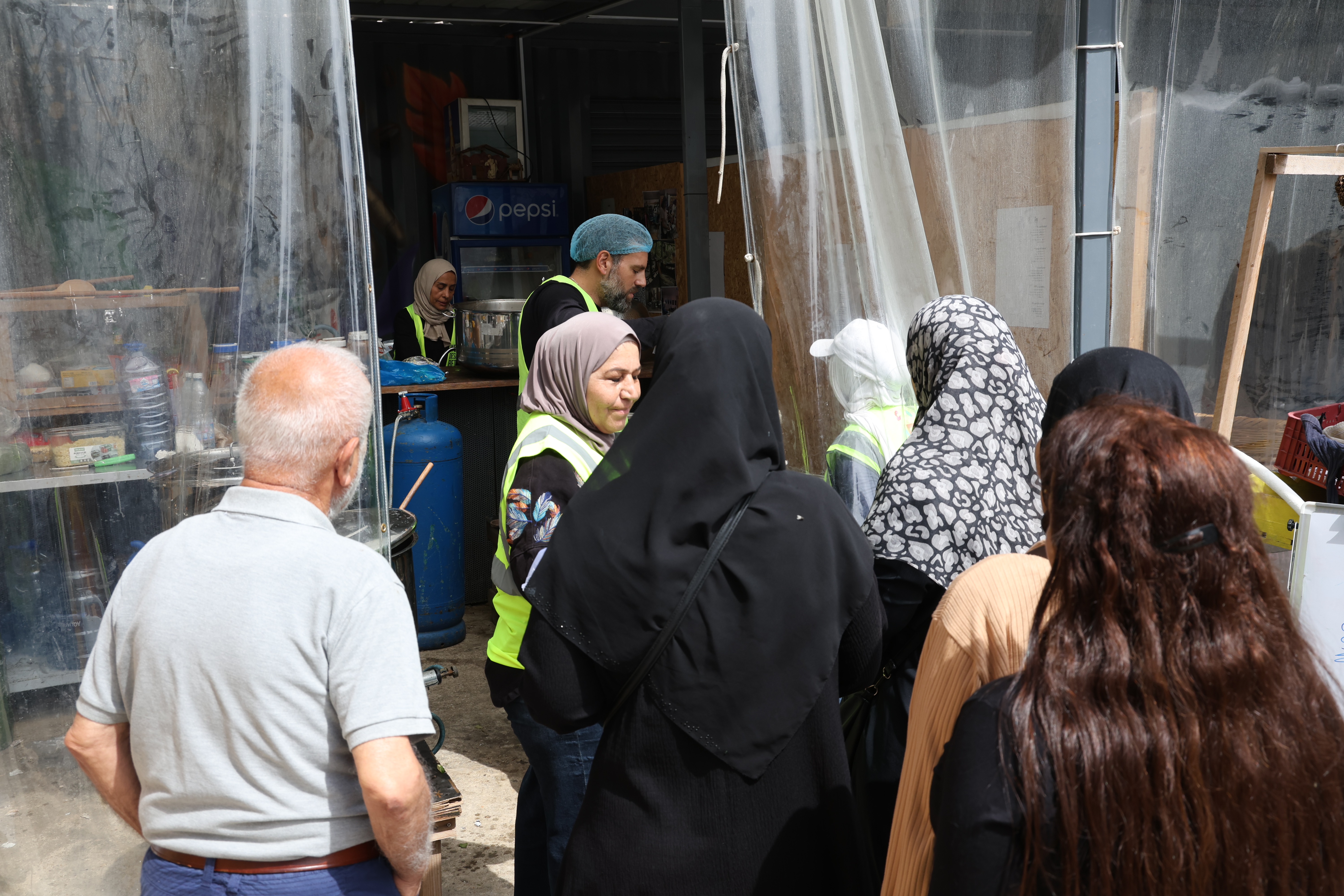 Families lining up to receive meals from WDBF